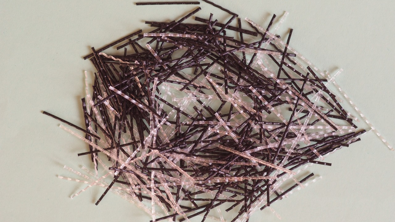 Concrete reinforcing fiber for strength and durability