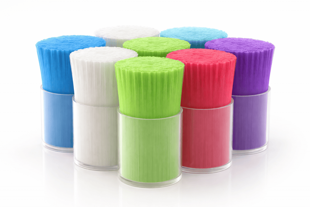 Monofilament bristles in various colors for oral care toothbrushes.
